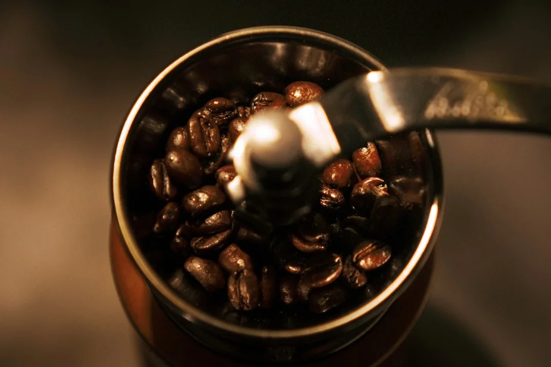 a coffee grinder filled with coffee beans