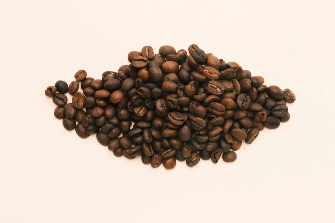 A pile of coffee beans on a white background